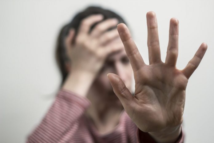 the-woman-shows-no-by-hand-refuses-harassment-the-girl-covers-her-face-1024x683